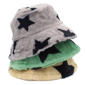 Close-up of plush faux rabbit fur bucket hats with star patterns in various colors