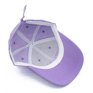 Inside view of purple cotton baseball cap showing sweatband and reinforced stitching