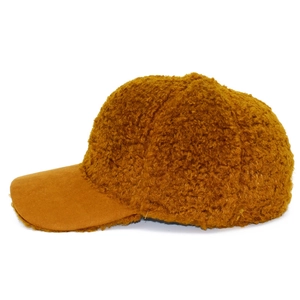 Detail view of brown fuzzy teddy fleece baseball cap with suede texture brim and six panels
