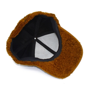 Detail view of the warm brown plush baseball cap with thick fleece and inner lining