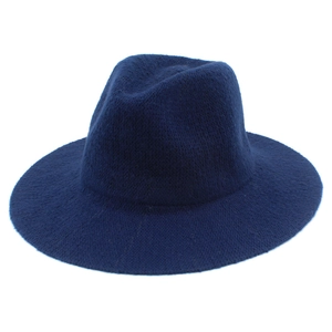 Detail showing the textured navy blue chenille knit fabric of the foldable fedora hat