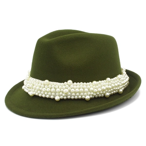 Detailed close-up of olive green wool fedora with decorative faux pearl headband trim