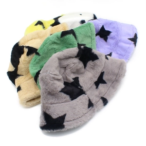 Plush faux fur bucket hats with star patterns in grey, beige, green, and purple colors