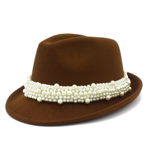 Detailed view of dark brown wool fedora hat featuring multi-layered white pearl beaded band