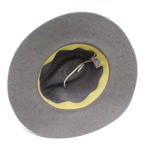 Detail view of knitted fedora hat showing internal sweatband and fabric composition label