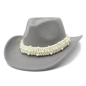 Detail of grey felt cowboy hat featuring elegant multi-size pearl bead band decoration