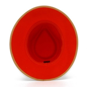 Close-up of wool fedora hat interior featuring red lining and beige edge detail