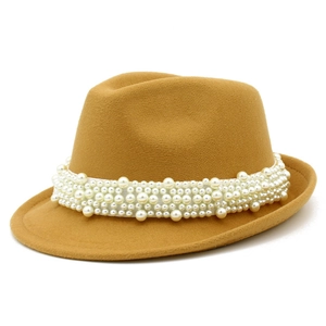 Detail of elegant wool jazz hat featuring a luxurious pearl band on high-quality felt