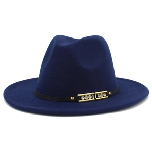 Detail of dark blue wool fedora featuring a black band with gold crystal accents