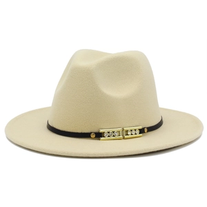 Close-up of beige fedora hat featuring a black leather band and gold rhinestone buckle