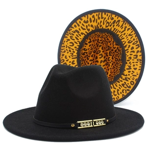 Detail of black wool fedora with leopard print brim lining and rhinestone buckle