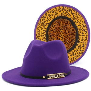 Detail of purple fedora hat with leopard print underbrim and rhinestone metal buckle