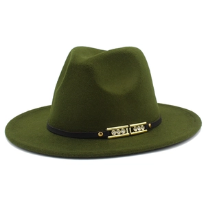 Detail of dark green wide-brim fedora with black band and gold rhinestone ornament