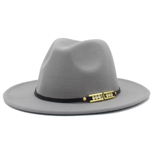 Close-up of gray wool fedora hat featuring a black leather band and gold rhinestone buckle