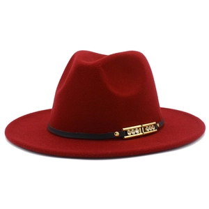 Detail of burgundy wool fedora featuring a black leather band and gold rhinestone buckle
