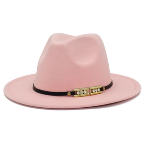 Detail of pink fedora hat with black decorative band and rhinestone golden buckle