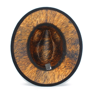 Detail view of the fedora interior showing tiger print lining and black felt brim