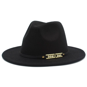 Close-up of black wide brim fedora with gold buckle and sparkling rhinestone detailing
