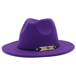 Close-up of purple fedora hat with black band, gold buckle, and sparkling rhinestones