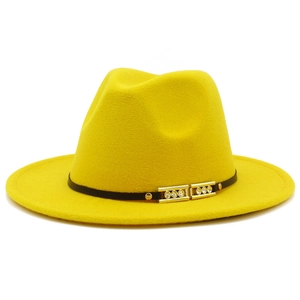 Detail of yellow wool fedora hat featuring black band with gold buckle and rhinestones