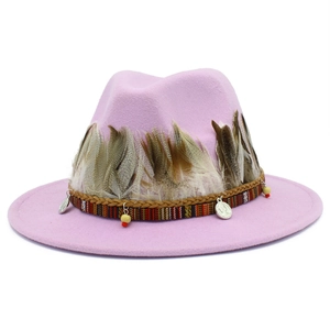 Pink felt fedora hat with bohemian feathers and ethnic beads for a classic elegant look