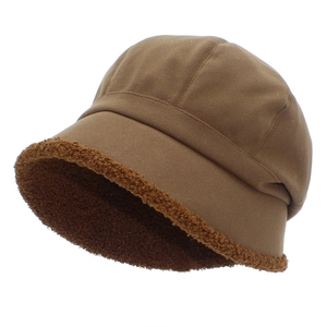 Winter dark brown wool-lined bucket hat with faux shearling brim and warm cotton fabric
