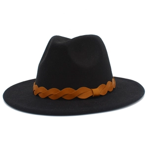Detail of British style black felt fedora hat featuring a brown braided decorative band