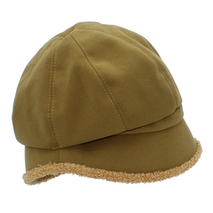 Detail of yellow cotton octagonal cap featuring plush faux fur trim on the brim