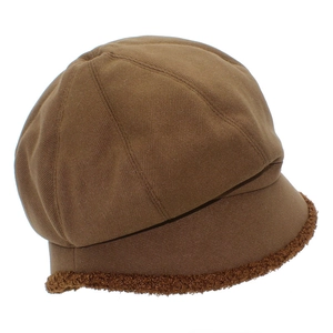 Detail view of brown newsboy cap showing twill fabric and warm plush fleece brim edges