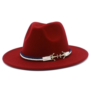 Detail of burgundy wool fedora with blue and white braided rope and gold anchor buckle