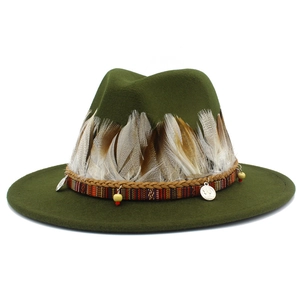 Detail of olive green fedora with bohemian feather trim and ethnic beaded charms