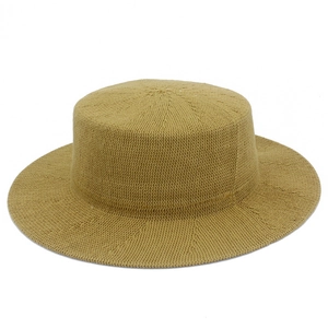 Detailed macro view of the khaki woven texture and flat top design on this sun hat