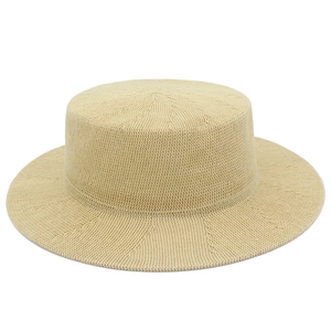 Elegant beige wide brim flat top straw hat with intricate woven texture and sun protection