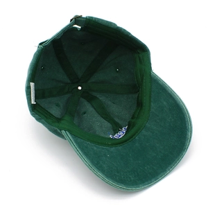 Detail view of the interior seams, 100% cotton label, and metal adjustment buckle on the cap