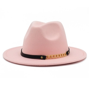 Detailed texture of pink wool fedora hat with black leather strap and gold chain accent