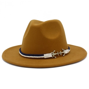 Close-up of mustard wool fedora featuring a nautical blue rope band and anchor metal detail