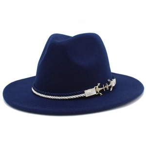Detail of navy felt fedora hat with white nautical rope and golden anchor metal ornament