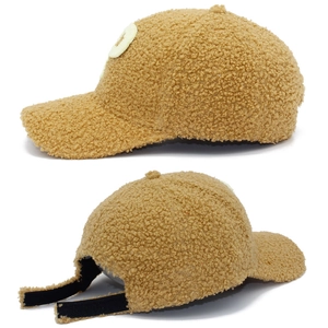 Detail view of khaki lamb wool baseball cap showing plush texture and velcro strap back