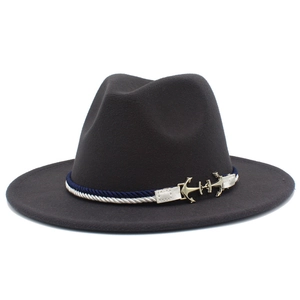 Detail of grey wool fedora hat with blue twisted rope band and golden anchor buckle