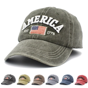 Macro view of washed cotton vintage baseball cap showing various colors and 1776 embroidery