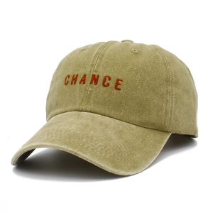 Close-up of the CHANCE embroidery and washed cotton fabric texture on the baseball cap