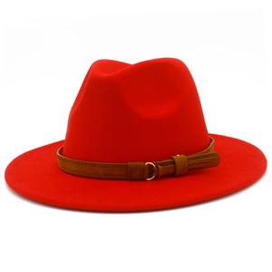 Close-up of red wool fedora with brown suede band and gold buckle detail