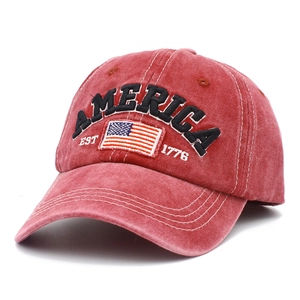 Detail of red washed vintage baseball cap with America 1776 embroidery and flag patch