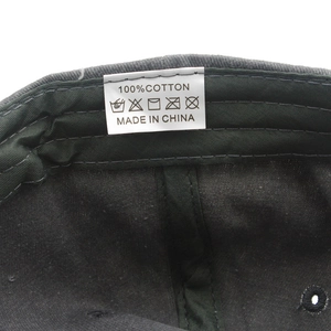 Close-up of internal cotton tag showing washing instructions and 100% cotton material