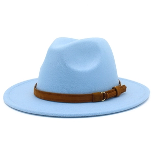 Close-up of light blue fedora hat featuring a brown leather band and gold buckle