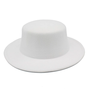 Detailed close-up of white wool felt flat top boater hat with wide brim and fine stitching
