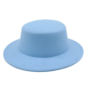 Detail of light blue wool felt boater hat showing flat crown and precise stitching