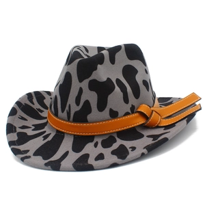 Cow print felt fedora hat with orange leather band and stylish curved brim design