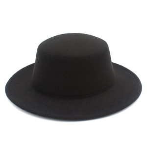Side view of a minimalist black flat-top wool felt hat with a wide straight brim