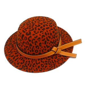 Detail of leopard print wool fedora hat with orange leather band and bow decoration